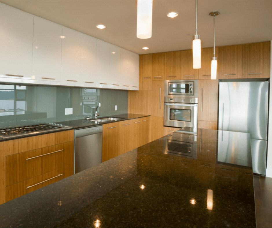 A black granite countertop in a modern kitchen