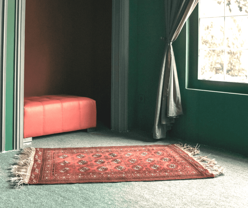 Red rug on carpet