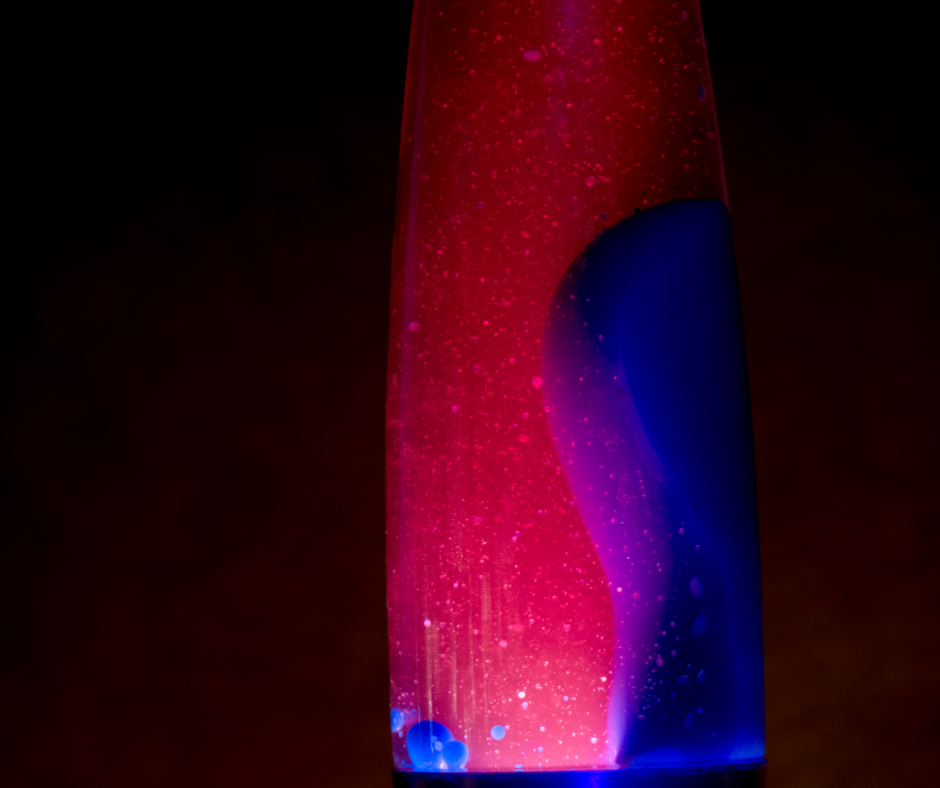 Red and blue lava lamp against a black background