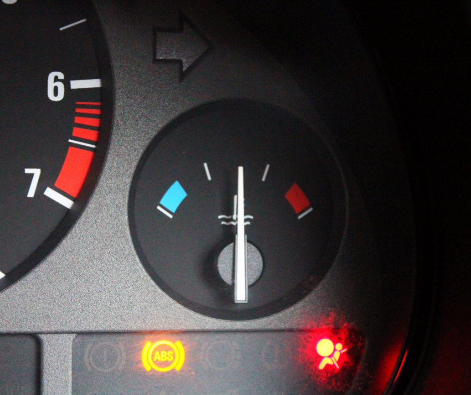 Temperature gauge inside a car showing normal levels