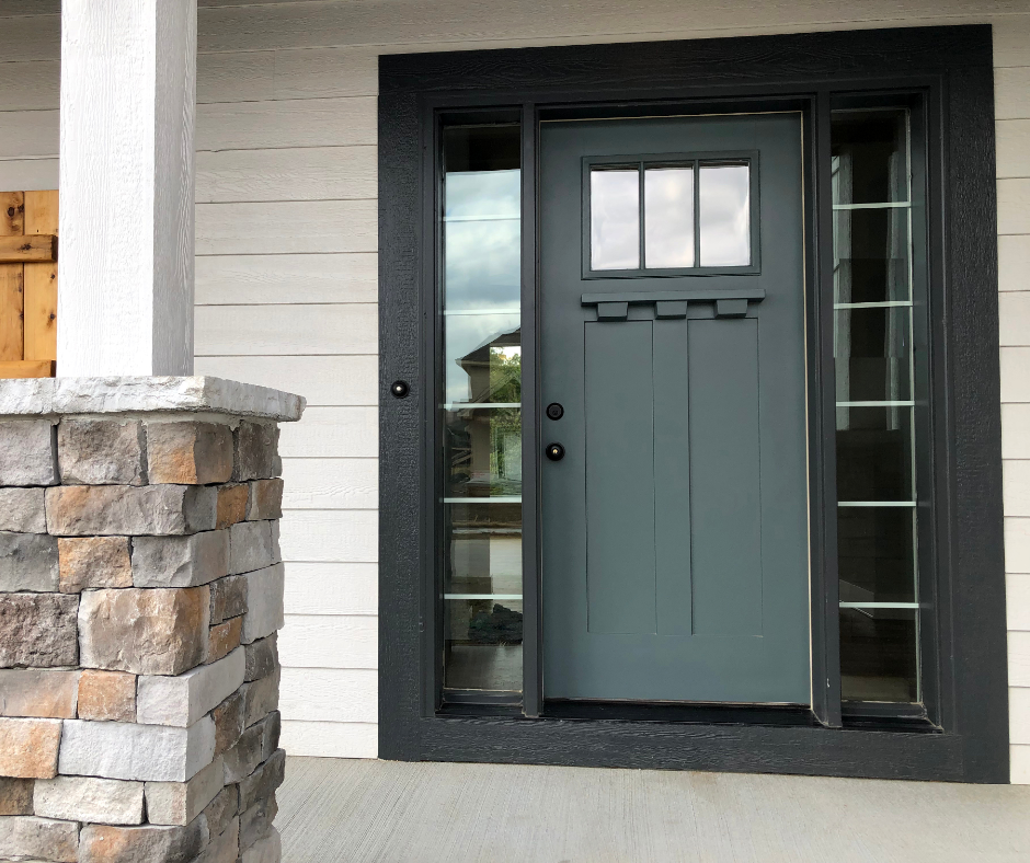 A front door painted in the shade of taiga.