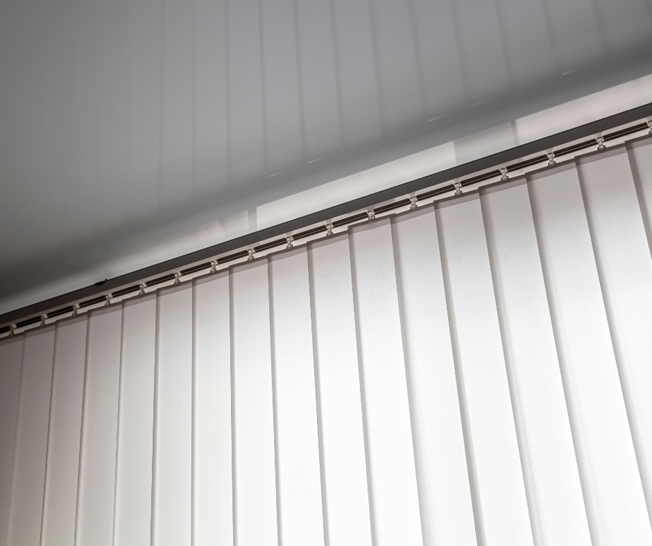 A close-up of vertical blinds railing