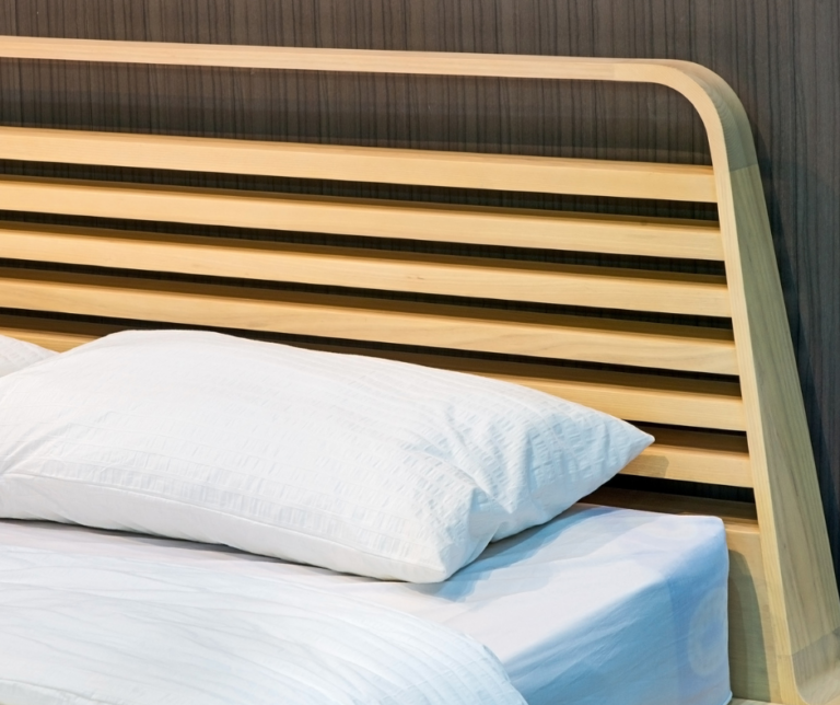 What Goes Behind a Headboard to Stop Wall Damage?