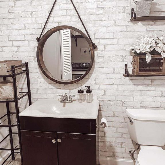 country bathroom with exposed white brick