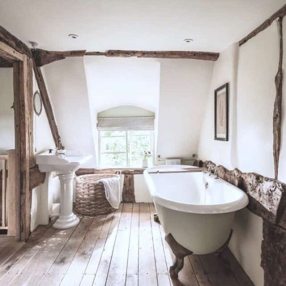 rustic country bathroom with exposed natural wood